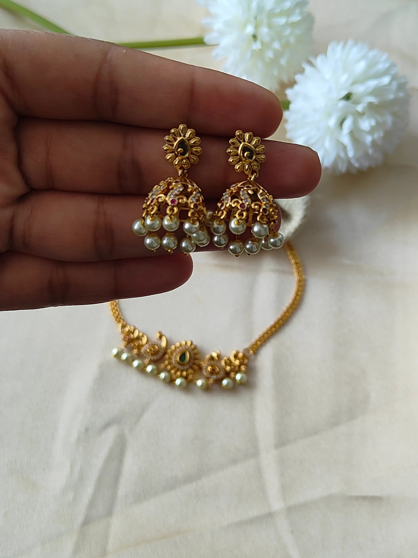 "Simple and classy peacock choker set".