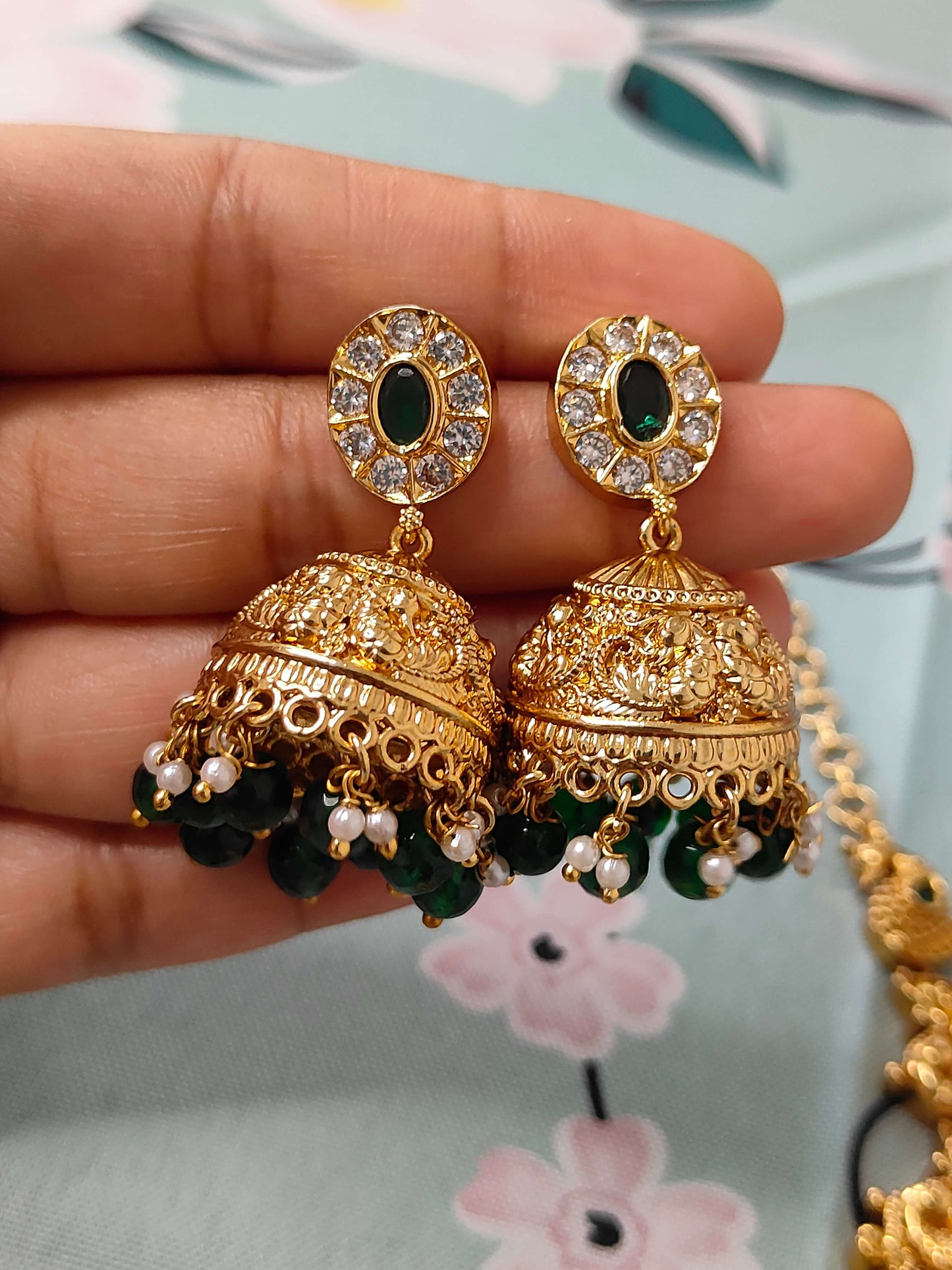 Traditional temple haram set with green and white pearls paired with jumkas