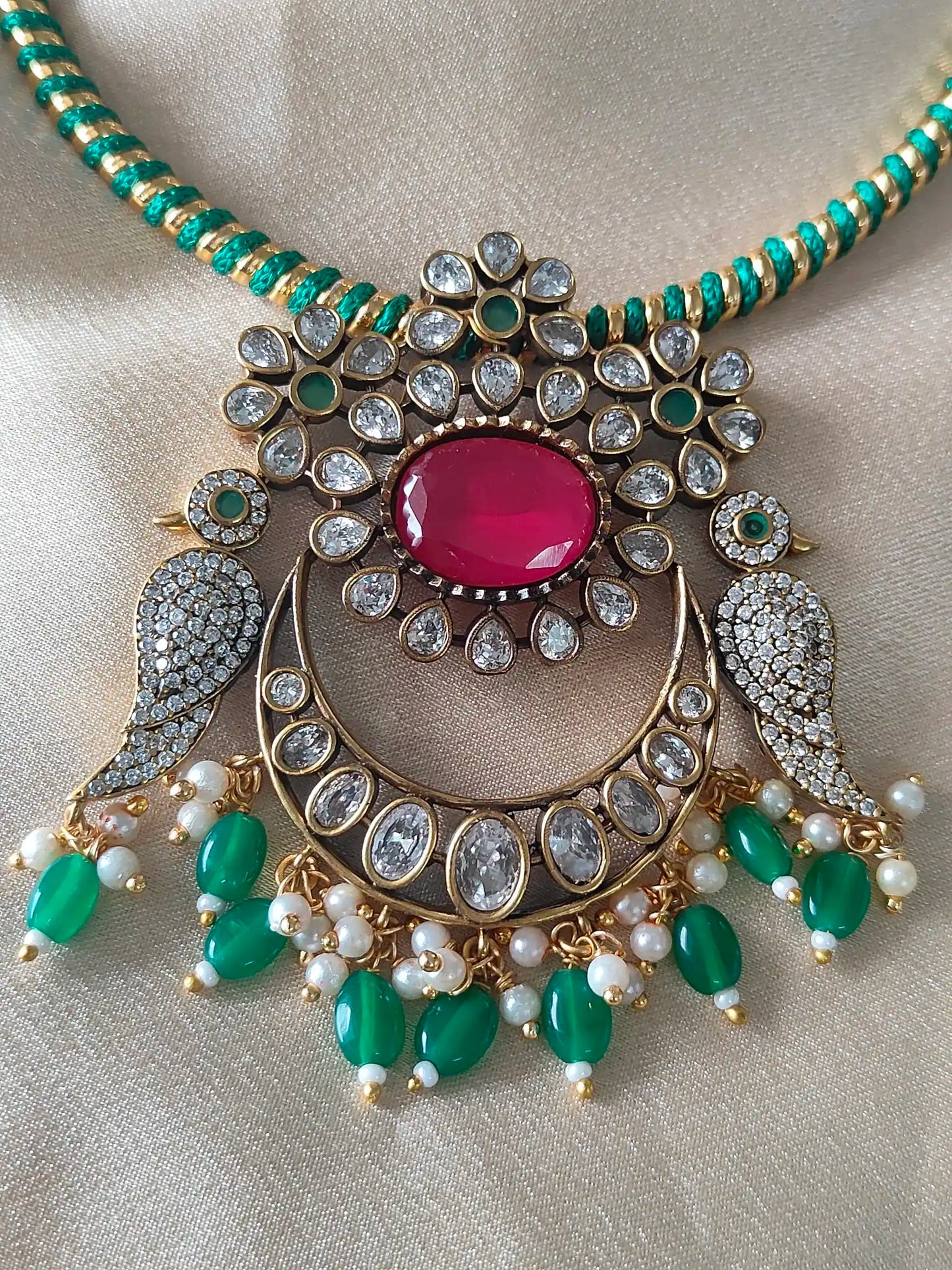 Peacock Inspired Kundan Necklace Set – Emerald & Ruby
Code -131