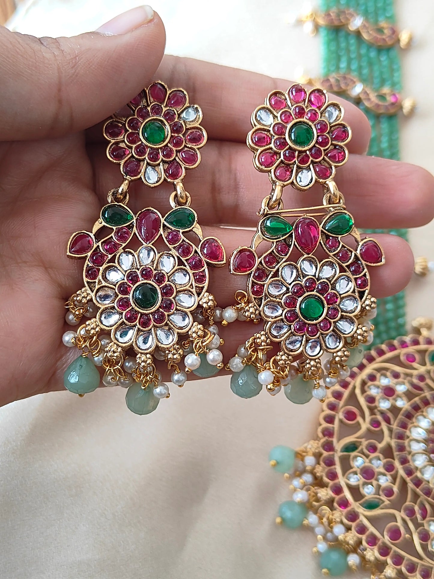 Grand Temple-Style Peacock Haram Set with Kundan and Green Bead Detailing