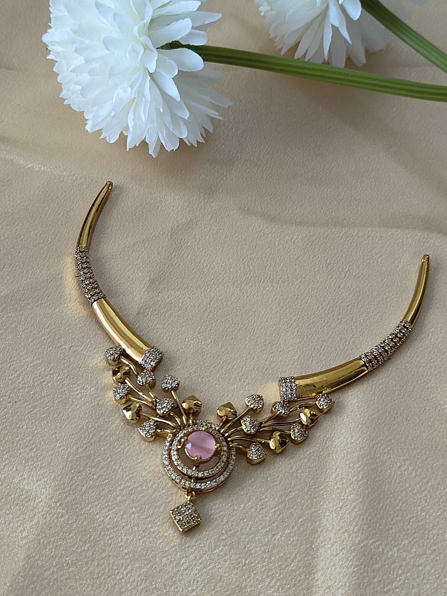 Gold plated hasli short necklace with ad stones.