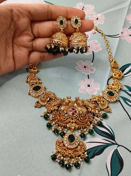 Traditional temple haram set with green and white pearls paired with jumkas