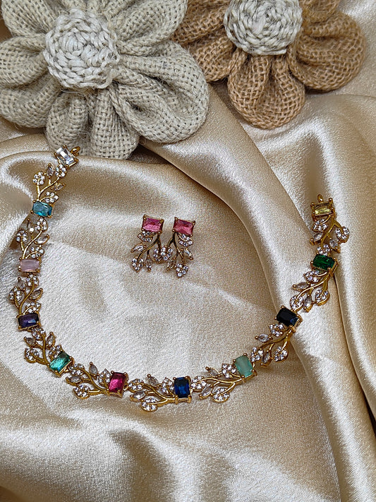 Leaf design necklace with multicolour stones.