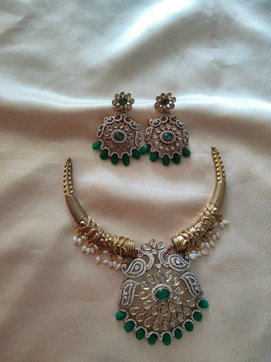 Kundan Hasli Necklace with Earrings – Emerald Detailing.       c - 180