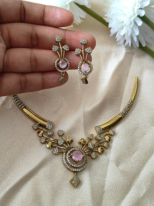Gold plated hasli short necklace with ad stones.